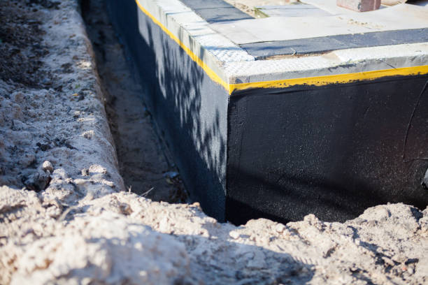 Professional Basement Waterproofing technician working in Rushville, IL